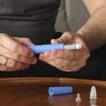 Two hands holding a genuine Semaglutide injection