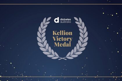 Sign of Kellion Victory Medal on a black background with stars and a grey laurel wreath